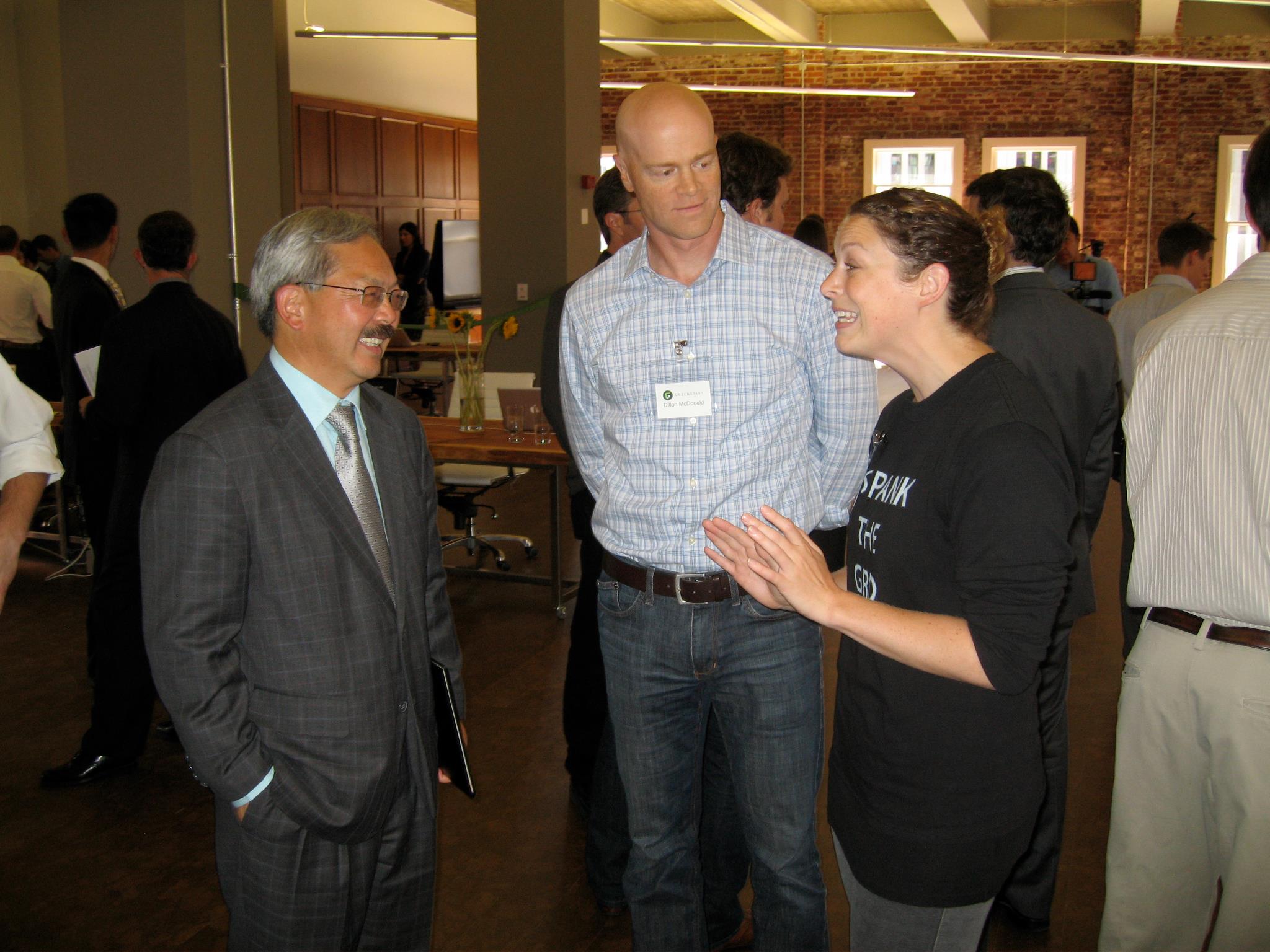Greenstart's Dillon McDonald and SF Mayor Lee enjoying Tenrehte CEO Jennifer Indovina's 'SPANK THE GRID' t-shirt explanation